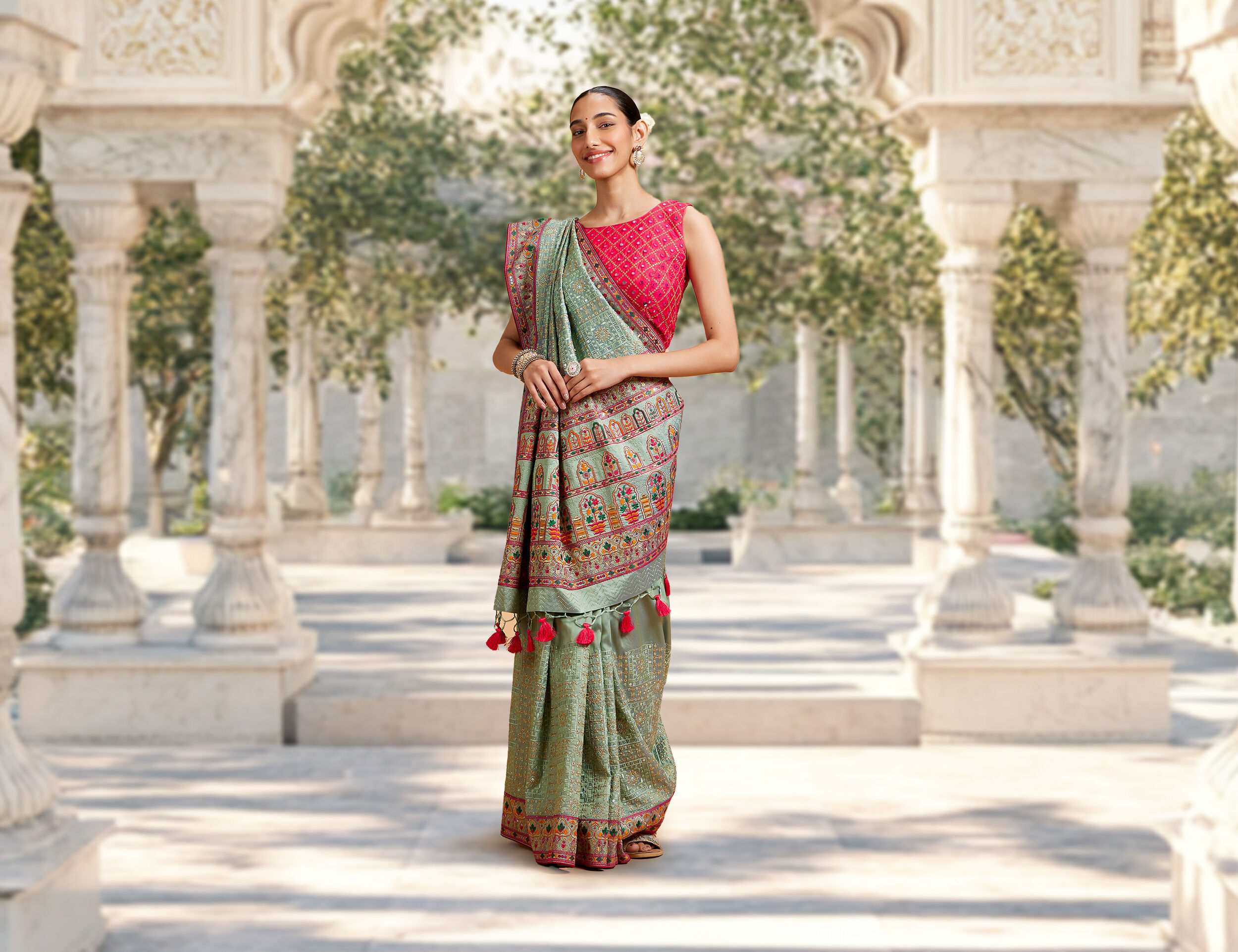 Girl wearing a beautifully draped saree with perfectly matched accessories for a wedding look
